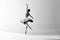 Monochrome. Young graceful ballerina posing in studio and demonstrating elegant movement