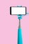 Monopod for selfie with smart phone. Selfie stick with smartphone isolated on pink background