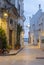 Monopoli - The old town aisle with the little chapel at dusk