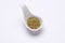 Monotone crushed Rosemary 1 tablespoon in a white spoon