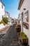 Monsaraz, Alentejo PORTUGAL - 1 August 2022 - Street and houses in the village with decoration and vases at the door