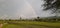 A monsoon period with rainbow