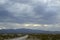 Monsoon rain clouds over mountain range edge of dry Mojave Desert valley Nevada, USA