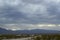 Monsoon rain clouds over mountain range edge of dry Mojave Desert valley Nevada, USA