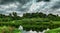 Monsoon skies with dark clouds and river