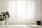 Monstera plant and pouf near large window with blinds in spacious room. Interior design