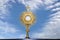 Monstrance - catholic religious symbol on blue background