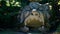 Monstrous sculpture called of Proteus and Glaucus at the Park of the Monsters of Bomarzo among trees and vegetation