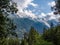 Mont blanc and the European Alps near Chamonix, Haute Savoie, France. Mountains seen through trees from the popular