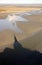 Mont Saint Michel Abbey shadow on the shivering sands