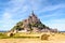 The Mont Saint-Michel tidal island in France with round bales of