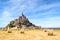 The Mont Saint-Michel tidal island in France with round bales of straw