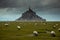 Mont St. Michel church near by the sea in Northern of France during cloudy with many sheep