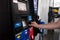 MONT-TREMBLANT, QUEBEC, CANADA, - SEPTEMBER 13, 2018: Male hand pays with a card at a gas station for fuel Quebec