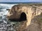 Montana De Oro California natural bridge archway with cave