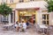 Monte Carlo, Monaco, 10/05/2019: People chat and have lunch in a city street cafe
