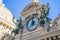 Monte-Carlo, Monaco 29.11.2020 Clock With Bronze Sculptures Of Angels Above The Main Entrance Of Monte-Carlo Casino In