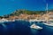Monte Carlo, Monaco - December 08, 2009: sea harbor with yachts and city on mountain landscape. Houses on sea shore with