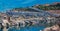 Monte Carlo panorama with luxury yachts and grand stands by the in harbor for Grand Prix F1 race in Monaco, Cote d'Azur