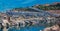 Monte Carlo panorama with luxury yachts and grand stands by the in harbor for Grand Prix F1 race in Monaco, Cote d\'Azur