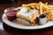 monte cristo sandwich with a side of fries and dip