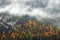 Monte Piana or Monte Piano, with beautiful autumn colors seen from the shore of Lake Landro.