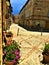 Montecassiano town, Marche region, Italy. Medieval buildings, ancient street, flowers, light, beauty, history and time