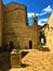 Montecassiano town, Marche region, Italy. Medieval buildings, precious ancient square and well, light and shadow, history and time