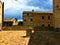 Montecassiano town, Marche region, Italy. Medieval buildings, precious ancient square and well, light and shadow, history and time