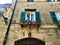 Montecassiano town, Marche region, Italy. Medieval buildings, windows, cat, plants,  beauty, history and time