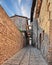 Montefalco, Perugia, Umbria, Italy: ancient narrow alley with arches in the medieval village