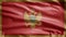 Montenegrin flag waving in the wind. Montenegro banner blowing soft silk