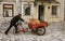 Montenegro - May 7, 2022 - Man pushes tricycle with propane tanks for homes