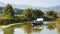 Montenegro, National Park Skadar Lake - September, 21 2018: A small boat with tourists in the middle of the Lake Skadar