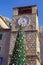 Montenegro. Old Town of Kotor. View of Clock Tower and Christmas tree on sunny winter day