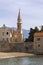 Montenegro. View of Old Town of Budva. Bell tower of Church of St John