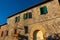 Monteriggioni,  Italy, 17 April 2022: historic center of the medieval town at sunset