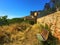 Monterubbiano town, Fermo province, Marche region, Italy. Wall, bench and secret path