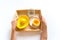 Montessori cooking Children`s hand squeezes juice from an orange