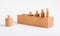 Montessori knobbed wooden cylinders incorrectly placed in block. Error in puzzle assembly. Kids game for development of