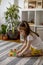 Montessori material. Colored movable alphabet made of wood on a board tray. Child toddler girl