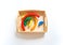 Montessori wood rainbow material. A child plays with a toy with his hands