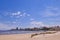 Montevideo beach with sand fence barriers and skyline on a sunny day, Montevideo, Uruguay