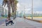 MONTEVIDEO, URUGUAY - MAY 04, 2016: people enjoying the afternoon on the board coast with the city as background