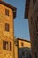 Montichiello - Italy, October 29, 2016: Quiet street in Montichiello, Tuscany with typical shuttered windows and paved streets