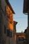 Montichiello - Italy, October 29, 2016: Quiet street in Montichiello, Tuscany with typical shuttered windows and paved streets