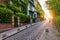 Montmartre district of Paris. Houses on narrow road in Montmartre district of Paris. View of cozy street in quarter Montmartre in