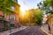 Montmartre district of Paris. Houses on narrow road in Montmartre district of Paris. View of cozy street in quarter Montmartre in