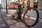 MONTREAL, CANADA - Mar 31, 2013: Old and Rusty Bicycle with Deflated Flat Rear Tire Safely Parked on a Pole with a Padlock