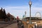 Montreal embankment - old lanterns, benches, ferris wheel, people walking along the embankment, leisurely rhythm of life, tourism